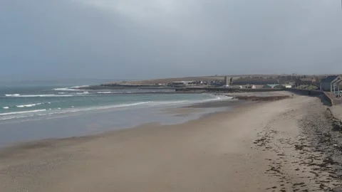 Sandy Beach at Thurso at Low Tide with Waves on a Dull Spring Day Stock Footage 332069742