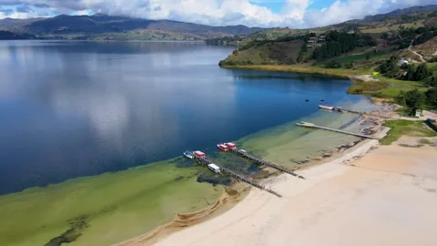 Sandy Beach at Tota Lagoon Under Blue Sky Stock Footage 330038846