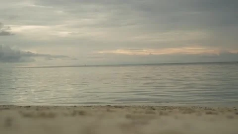Sandy beach on a tropical island. The waves of the sea wash the shore. In the Stock Footage 264472397