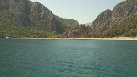 Sandy Beach in Turkish Mountains Viewed from a Yacht Stock Footage 303724527