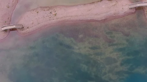 Sandy beach with two small wooden bridges and piers Stock-Footage 95835463