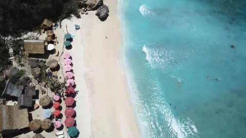 Sandy Beach with Umbrellas and Blue Ocean from Above [Drone Footage] Stock Footage 96283036