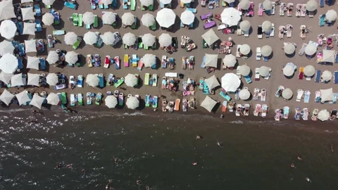 Sandy beach with umbrellas and sunbeds from above Stock Footage 212115342