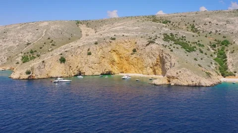 Sandy beach under cliffs at Zlata Beach Stock Footage 327553206
