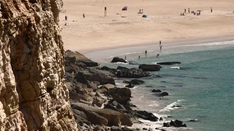 Sandy beach under rocks Stock Footage 250981061