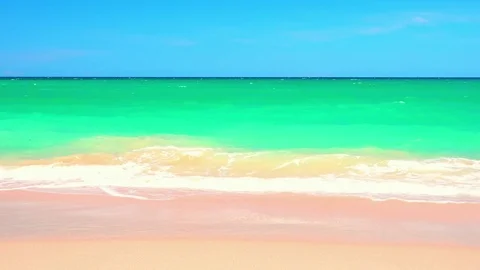 Sandy beach washed by white-crested waves of azure tropical sea Stock Footage 72783273