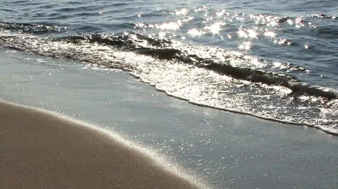 Sandy beach waves coming in Stock Footage 24454491