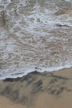 Sandy beach with waves 스톡 사진