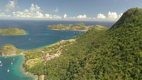Sandy coves set between low rock headlands in Guadeloupe Vídeos de archivo 101611317