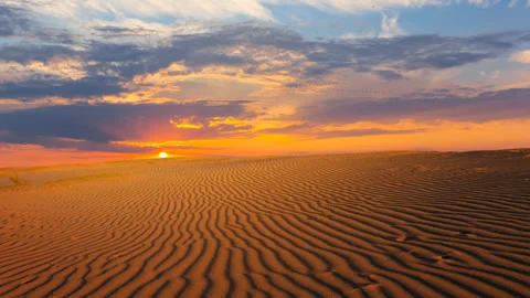 Sandy desert at the dramatic sunset time lapse scene Stock Footage 243666032