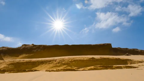 Sandy desert under a sparkle sun, wild nature time lapse scene Stock Footage 147483611