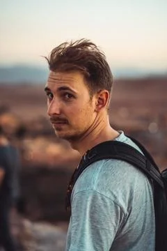 Sandy destination: A man's weathered face tells tales of adventure, resilie.. Stock Photos