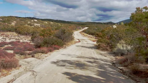 Sandy Dirt-road at fall between the hills of Aguanga, CA Stock Footage 217396930