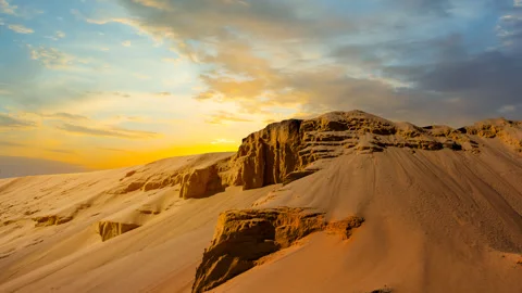 Sandy dune slope in light of red dramatic sunset Stock Footage 317176225