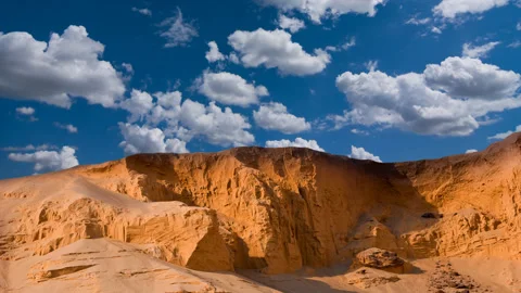 Sandy dune under a cloudy sky, sand desert time lapse scene Stock Footage 148838755