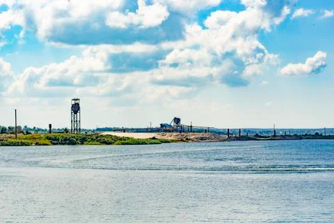Sandy empty beach on the background of the lake and blue sky 5 写真素材