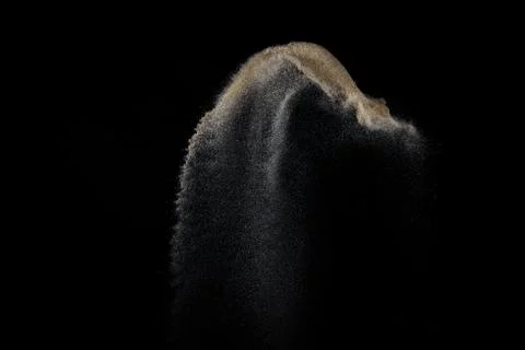 Sandy explosion isolated on black background. Stock Photos