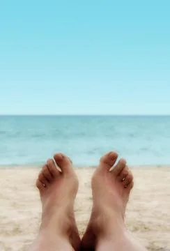 Sandy Feet on the Beach Stock Photos