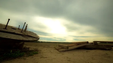 Sandy field and Cloudy sky. camera movement. the coil wire. Time Lapse 4K Stock Footage 72152904