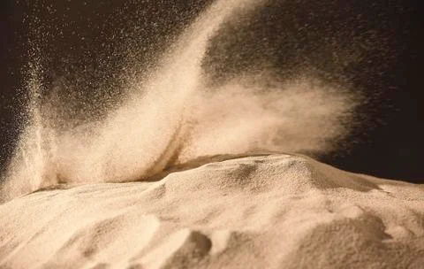 Sandy fly wave over dark background. Stock Photos