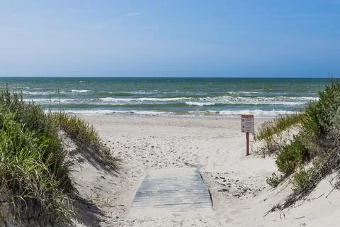 Sandy Footpath Through Dunes to Baltic Sea Beach with Rolling Waves Stock Photos