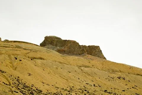 Sandy mountain hill with rocks Stock Photos