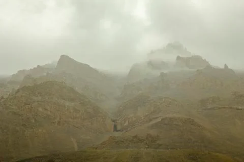 Sandy mountains before rain in dark clouds Stock Photos