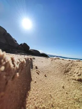 Sandy path on the beach on a sunny day Stock Photos