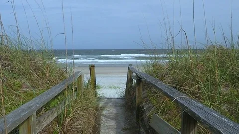 Sandy Path to Ocean Shore, Slow Motion Crane Up Video stock 76498301