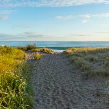 Sandy path on remote beach Stockfoto's