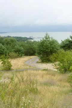 The sandy road from the hill Stock Photos