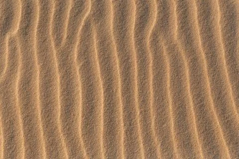 Sandy sand pattern on the beach Stock Photos