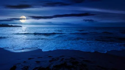 Sandy sea beach background on cold summer night Stock Photos