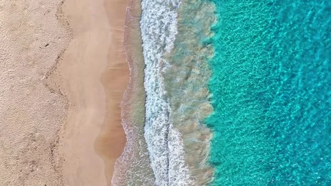 A sandy sea beach background with turquoise sea waves. Видео 330039680