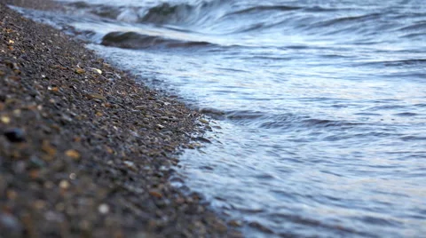 Sandy shore washed by the waves. Shallow DOF Stock Footage 67999899