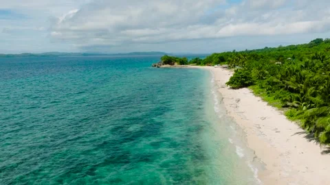 Sandy shoreline with clear turquoise waters. San Jose, Romblon, Philippines. Stock Footage 310356523
