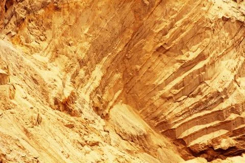 Sandy slope with layered texture as abstract background. Stock Photos