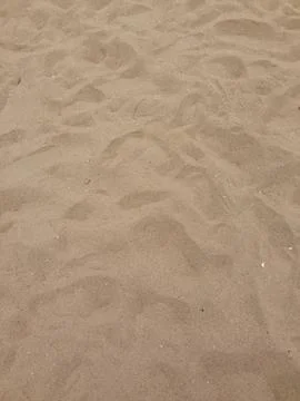 Sandy Surface With Footprints Stock-Fotos