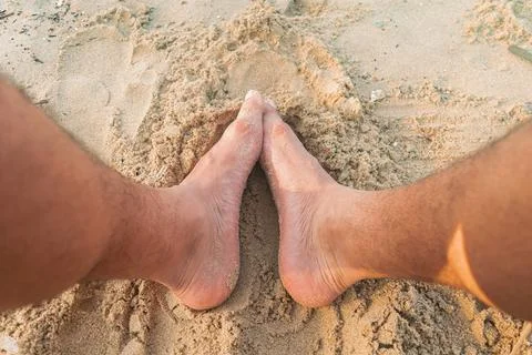 Sandy toes on the beach Stock Photos