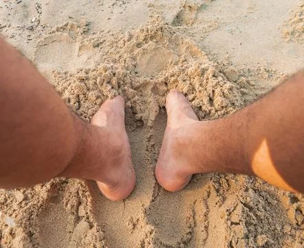 Sandy toes on the beach Stock Photos