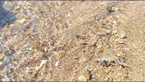 The sandy water flow on the beach is beautiful, unique and rare Stock Footage 277812418