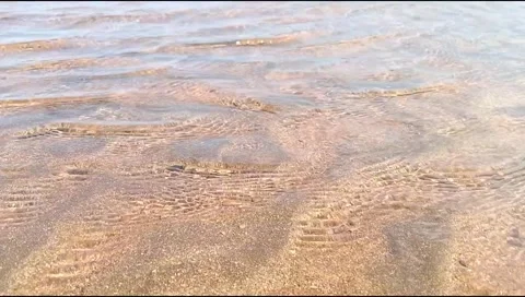 The sandy water flow on the beach is beautiful, unique and rare Stock Footage 277814048