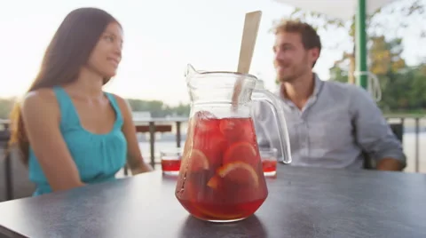 Sangria pitcher jug - Couple drinking traditional Spanish drink Video stock 62735246