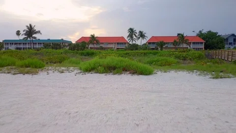 Sanibel Beach to Condo Stock Footage 92039349