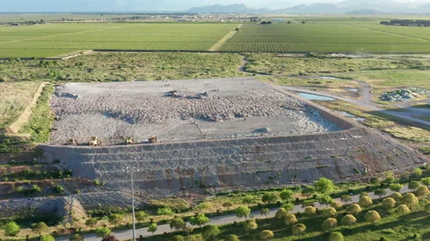 Sanitary landfill site - dumping ground where rubbish and garbage is disposed of Stock Footage 154058633