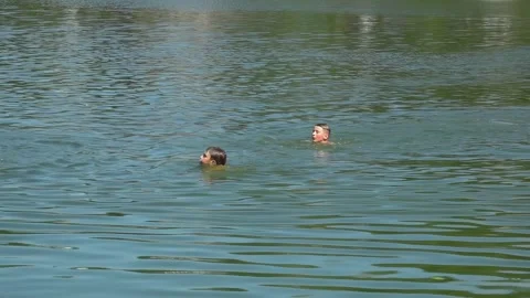 Sanitary service officer testing river water quality during hot summer heatwave. Stock Footage 342118326