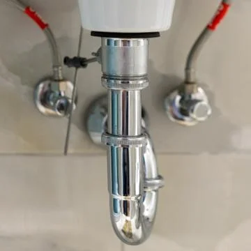 Sanitary technical elements in the washbasin Stock Photos