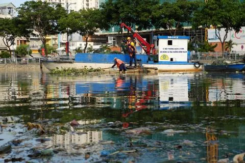 Sanitation worker picking up trash Stock Photos