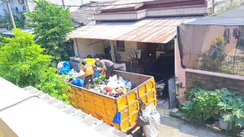 Sanitation workers sorting household waste garbage truck residential galuga land Stock Footage 341916134