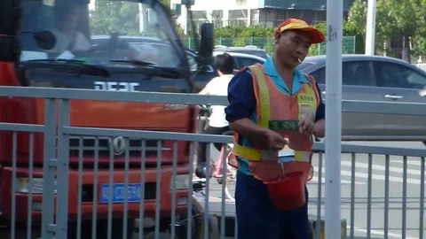 Sanitation workers in the wire rod to remove stains and then paint Stock Footage 69822521
